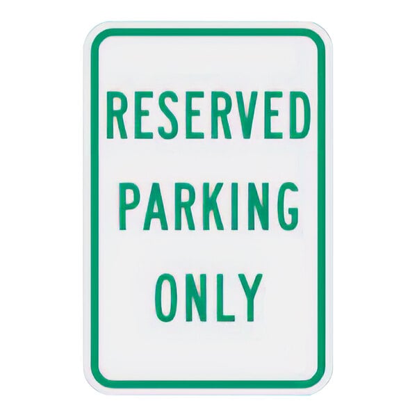 A white sign with green text reading "Reserved Parking Only"