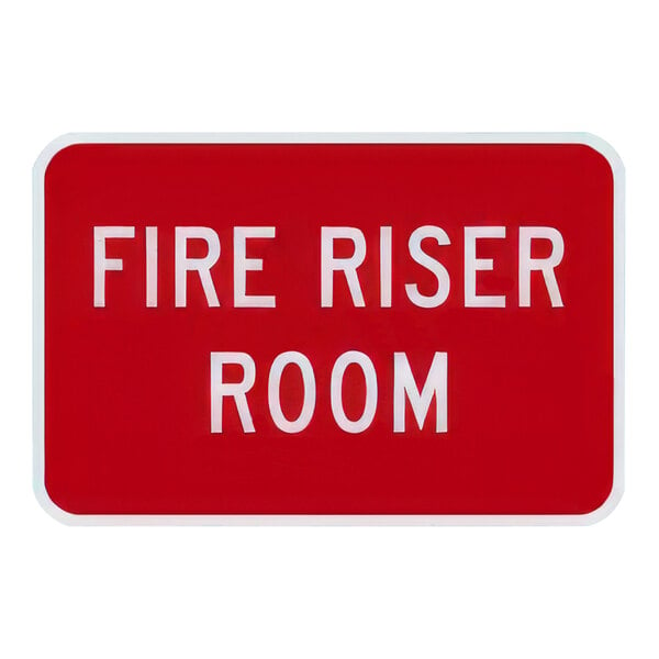 A red and white Lavex "Fire Riser Room" safety sign on reflective aluminum.