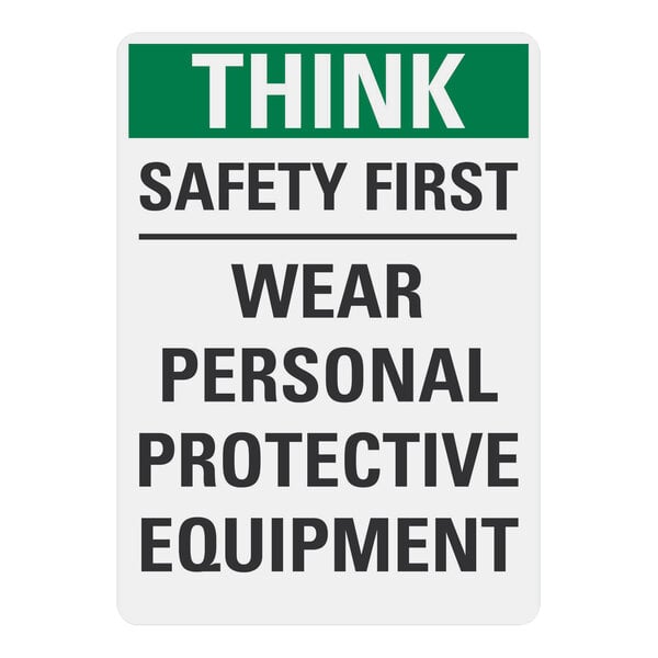 A white rectangular sign with black text that says "Think Safety First Wear Personal Protective Equipment" on it.