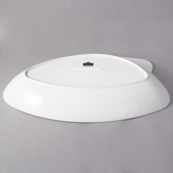 A white 10 Strawberry Street porcelain serving bowl with a logo on the bottom.