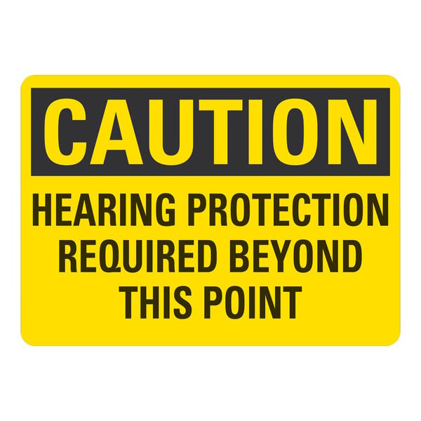 A yellow and black Lavex plastic sign that says "Caution Hearing Protection Required Beyond This Point"