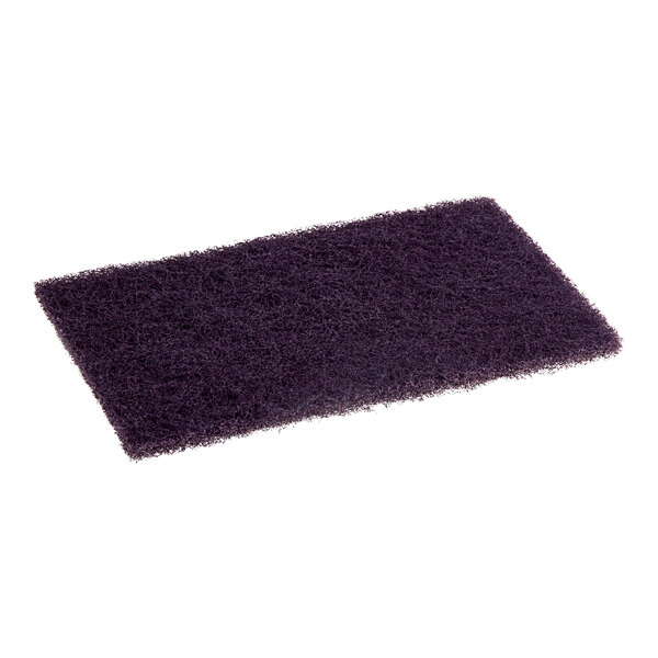 A close-up of a purple abrasive pad with a rectangle in the middle.