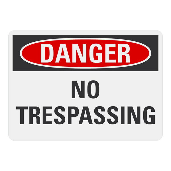 A white rectangular aluminum sign with black text that says "Danger / No Trespassing"