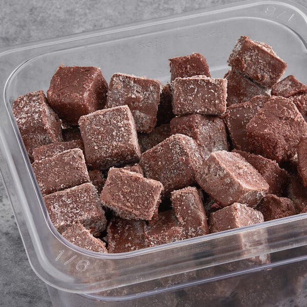 A container of brown cubes of Makai Organic Sweetened Acai Blender Cubes.