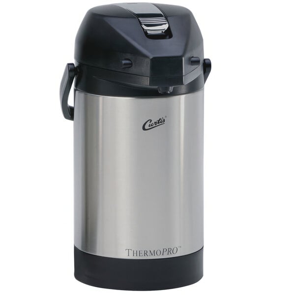 A stainless steel Curtis airpot with a black lid.