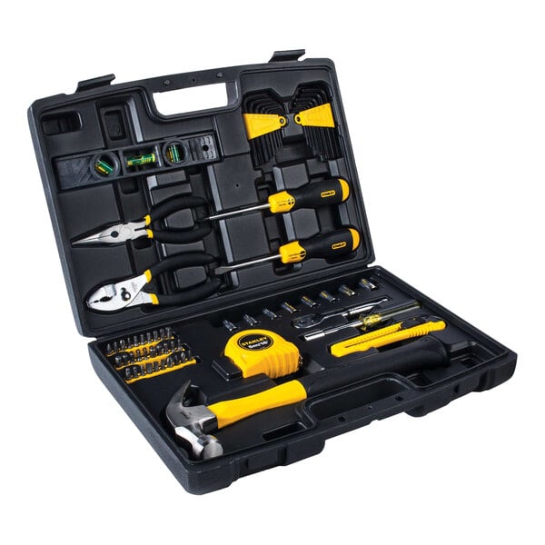 A black and yellow Stanley tool box with many tools inside.