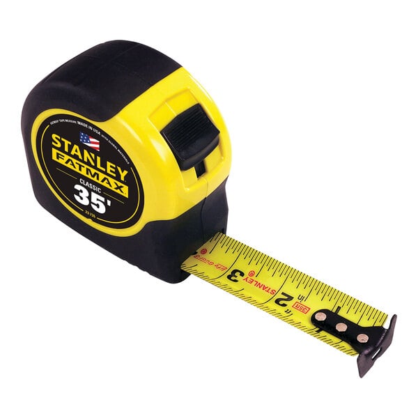 A Stanley FATMAX tape measure with a yellow and black tape.