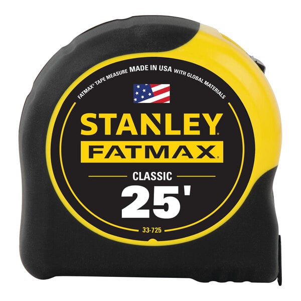 A Stanley FATMAX yellow and black 25' tape measure on a table.