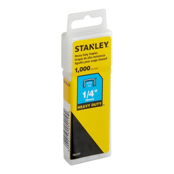 A Stanley reusable plastic container of 1/4" heavy-duty staples. The container is white with a yellow label and black text.