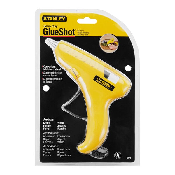 A yellow Stanley GlueShot heavy-duty hot melt glue gun in packaging.