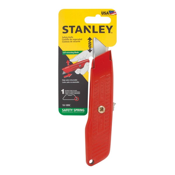 A Stanley self-retracting safety utility knife with a red handle and round-point blade in packaging.