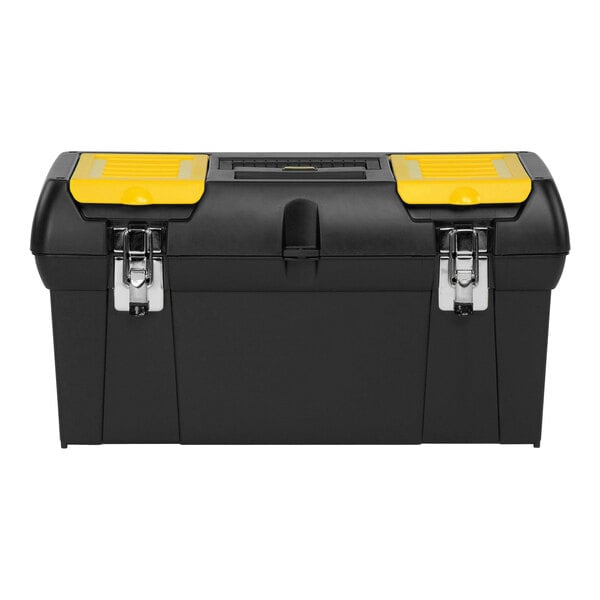 A Stanley black and yellow toolbox with four compartments and one tray.