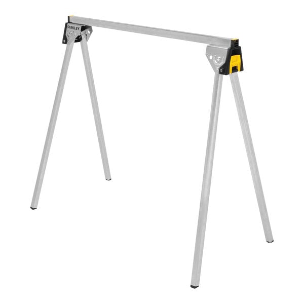 A pair of Stanley metal folding sawhorses with yellow handles.