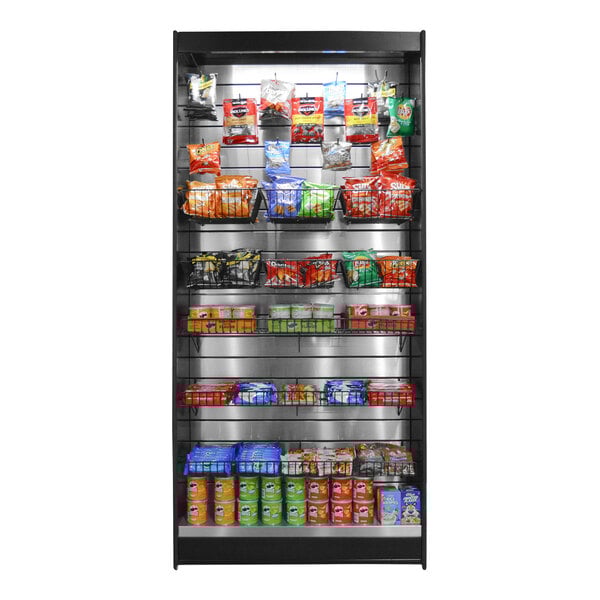 A stainless steel micro market stand with a black metal shelf of chips and snacks.