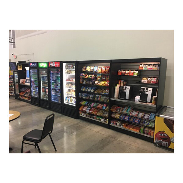 An All State Manufacturing stainless steel micro market stand with a variety of snacks and drinks on display.