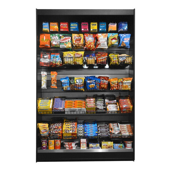 A stainless steel micro market stand with snacks on shelves.