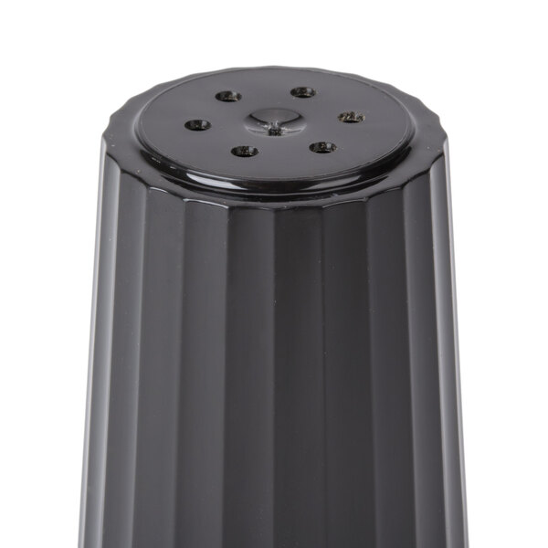 A black cylindrical prefilled pepper shaker with holes.