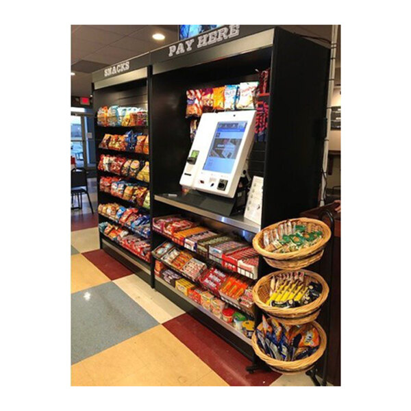 An All State Manufacturing stainless steel micro market stand with double shelves holding food items.