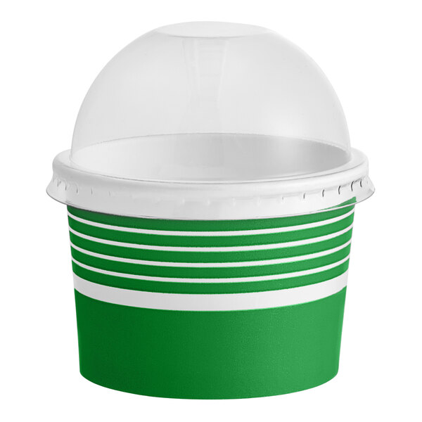 A green and white container with a clear dome lid.