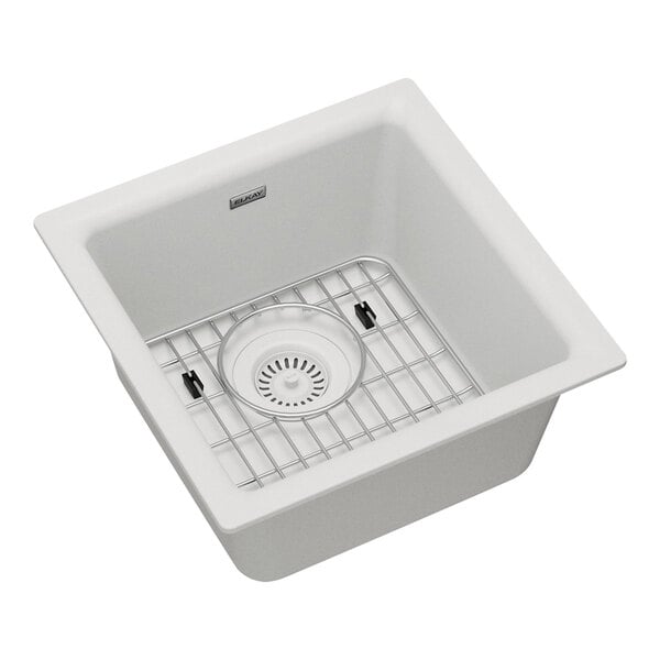 A Zurn Elkay white quartz dual mount bar sink with a drain rack.