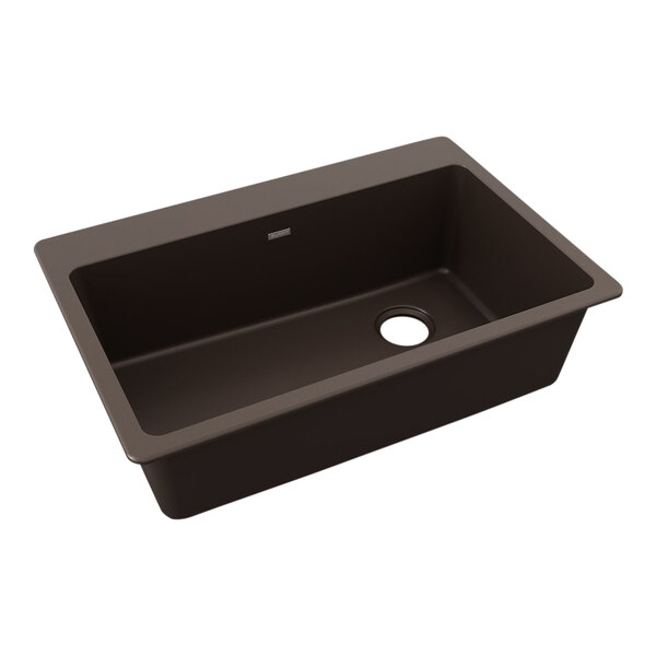 A brown Zurn Elkay Quartz Classic drop-in sink with a hole in the middle.