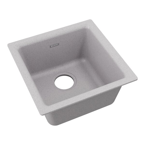 A greystone Zurn Elkay Quartz Classic sink with a drain hole in the middle.