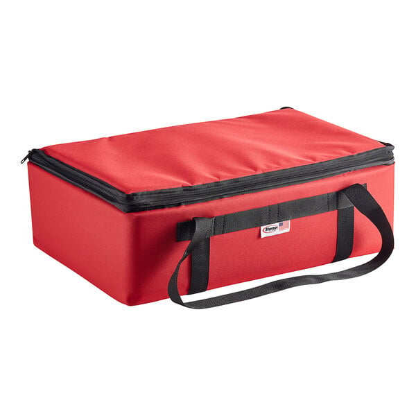 A red nylon insulated catering food carrier with black straps.