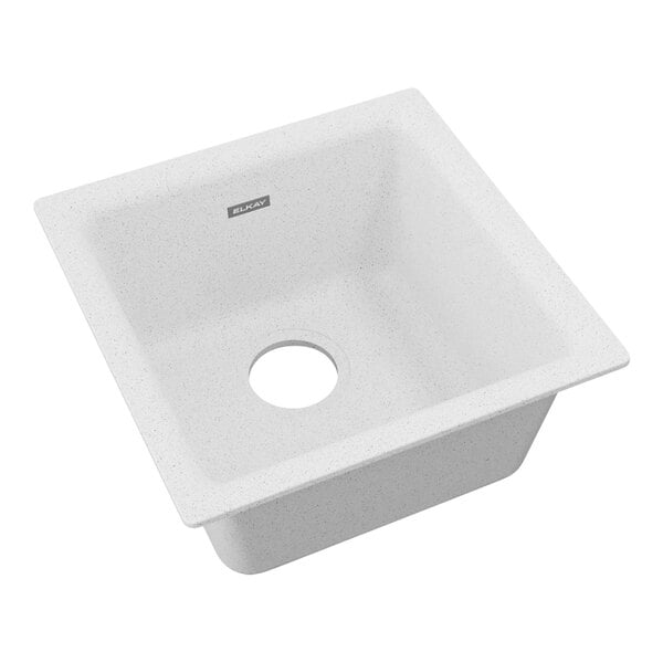 A white Zurn Elkay Quartz Classic square sink with a drain hole in the middle.