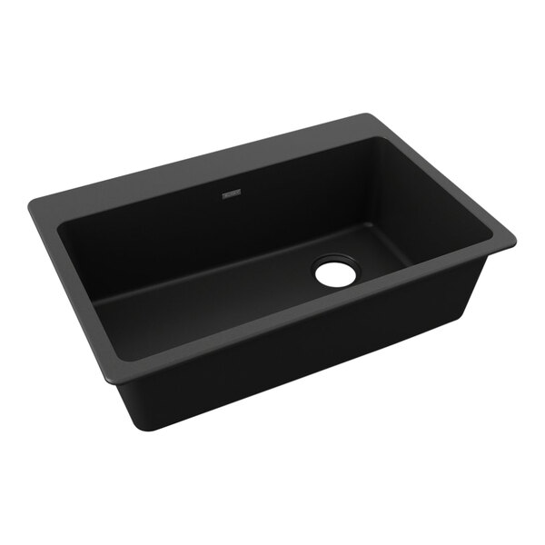 A Zurn Elkay black quartz drop-in sink with a drain hole.