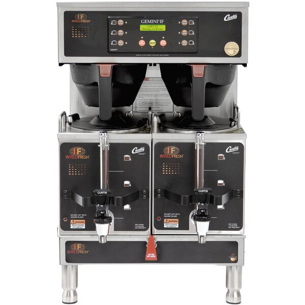 A Curtis Gemini stainless steel coffee machine with two coffee pots on top.