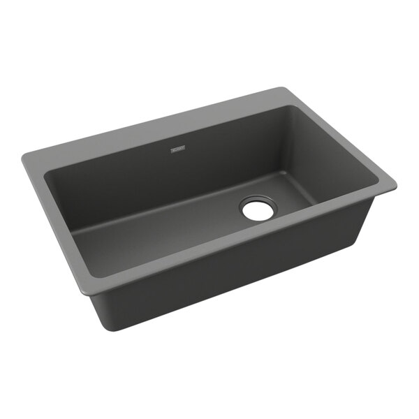 A Zurn Elkay Dusk Gray Quartz drop-in sink with a drain.