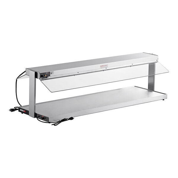 A stainless steel ServIt heated buffet warmer with a glass shelf.