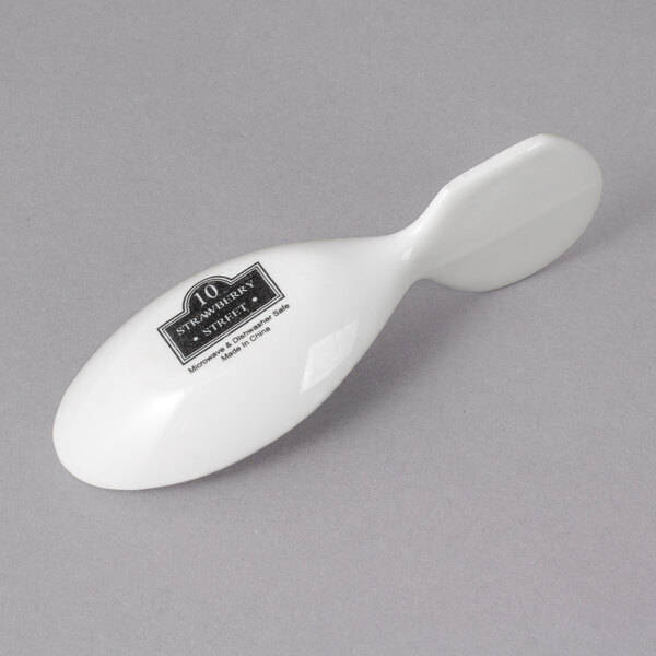 A white 10 Strawberry Street Whittier porcelain spoon.