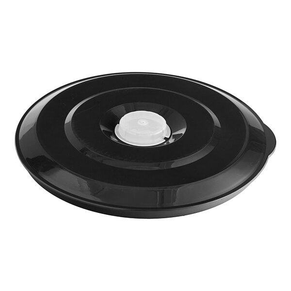 A black plastic lid for an Avamix tilting blender with a white button.