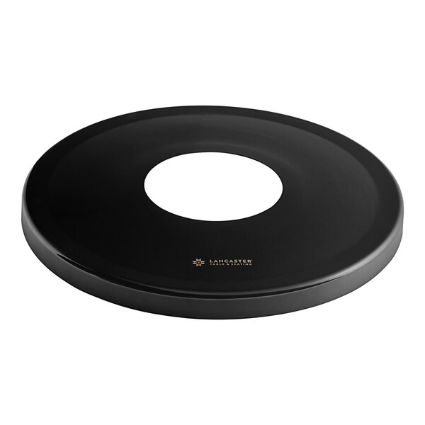 A black plastic flat lid with a white circle on it.