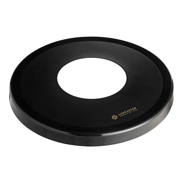 A black circular lid for a 36 gallon outdoor trash can.