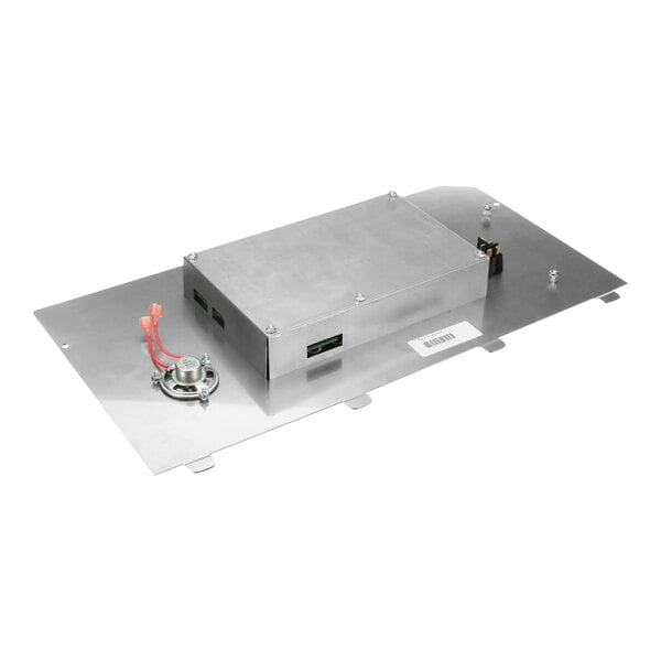 A silver rectangular metal box with wires and a white label.