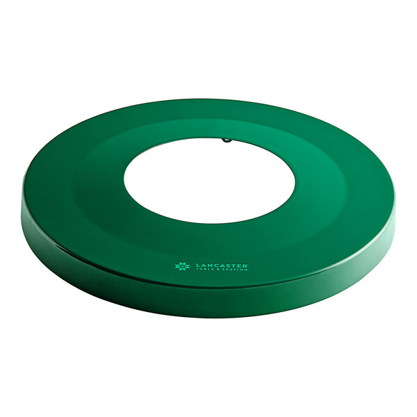 A green circular plastic lid with a hole in the middle.