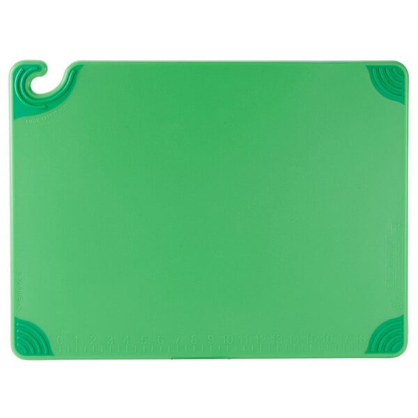 A green San Jamar cutting board with a handle and hook.