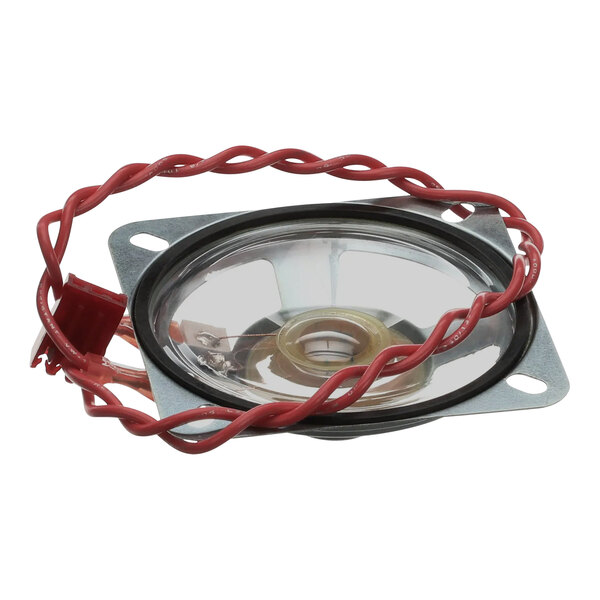 A round metal speaker with red and white wires.