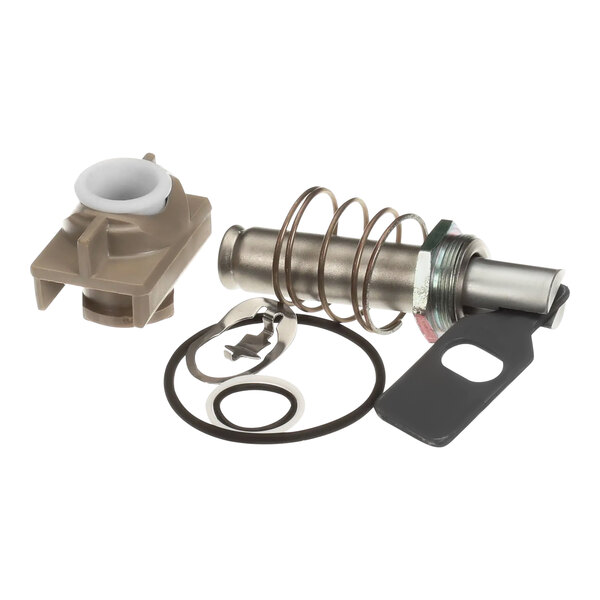 A Henny Penny Solenoid Rebuild Kit with a metal cylinder, spring, and plastic ring.