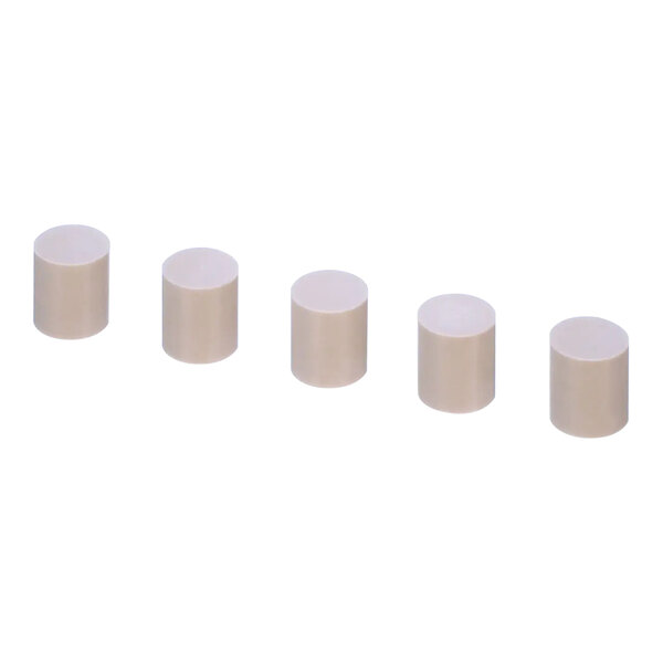 A row of white cylindrical caps.