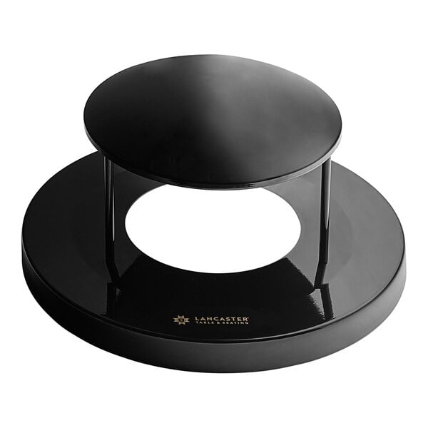 A black round Lancaster Table & Seating lid with a round center and base.