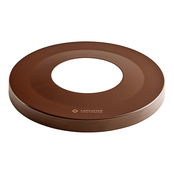 A brown circular lid with a white circle in the middle.