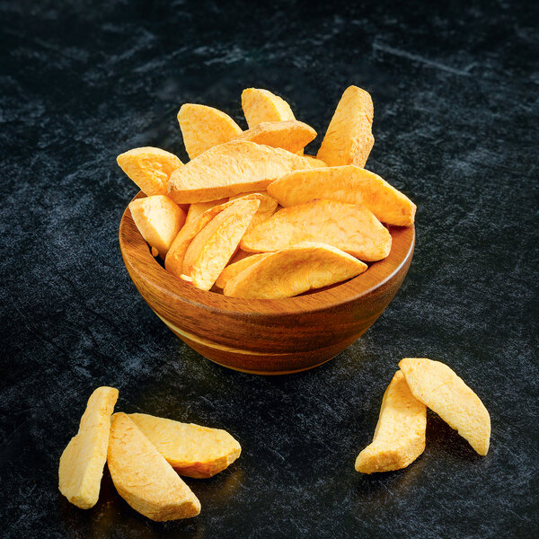 Freeze-dried sliced peaches in a bowl.