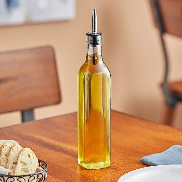 A Choice oil and vinegar cruet on a table.