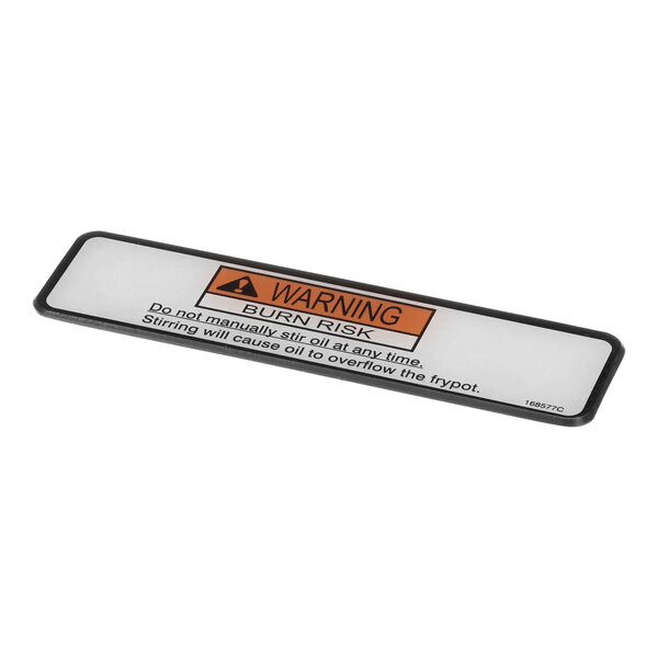 A close-up of a Henny Penny danger warning label.