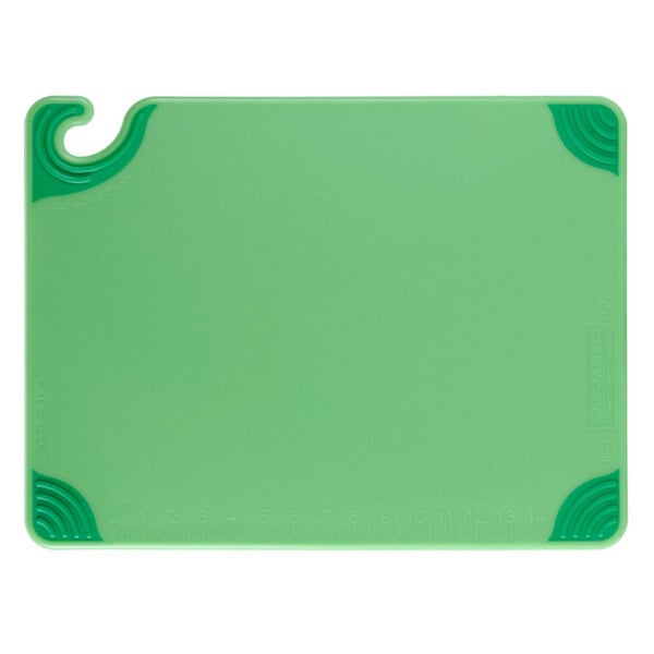 A green plastic San Jamar cutting board with green handles and a hook.