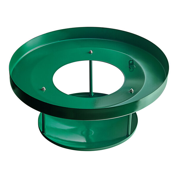 A green metal circular lid with a hole in the middle.