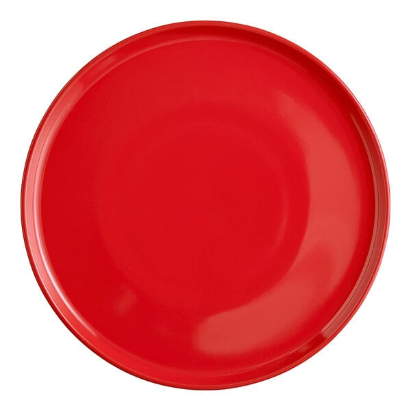 A close-up of a red Acopa stoneware pizza plate with a circle in the middle.